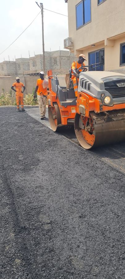 Asphalt paver laying a new road