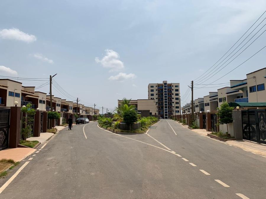 Estate road perspective with buildings on both sides