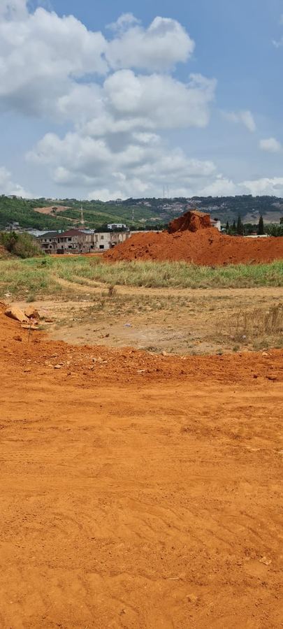 Earthworks on red soil for a resettlement road project