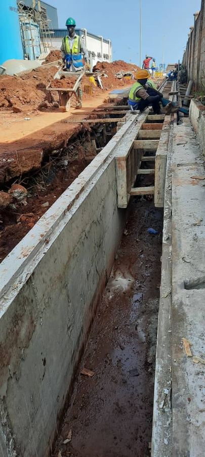 Concrete drainage trench under construction