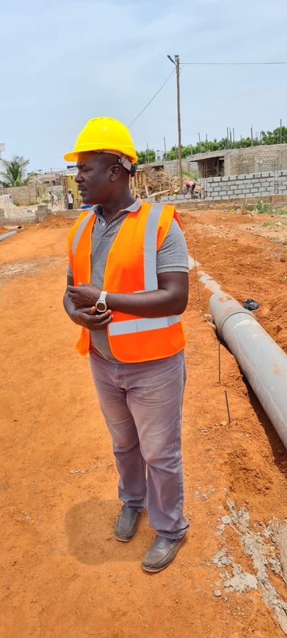 Worker on site with drainage pipe
