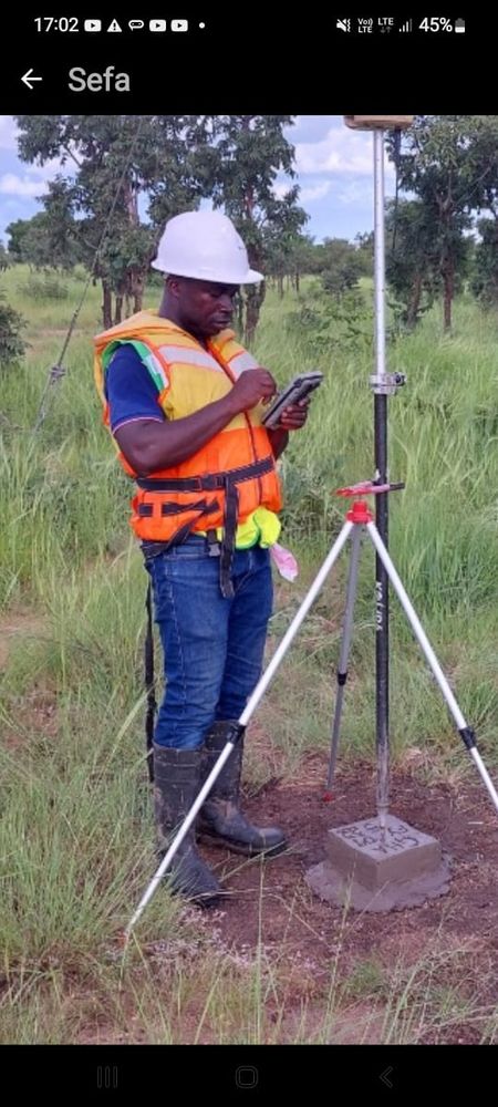 Surveyor taking topographical readings